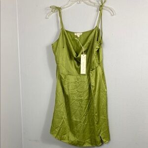 green satin mini dress with a cowl neck and tie-up spaghetti straps